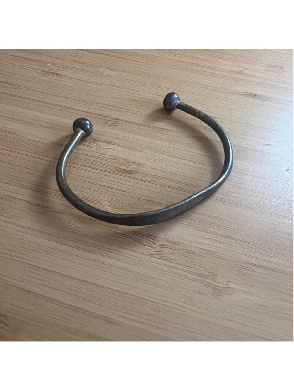 925 sterling silver cuff bracelet with name “Sydney” etched into it